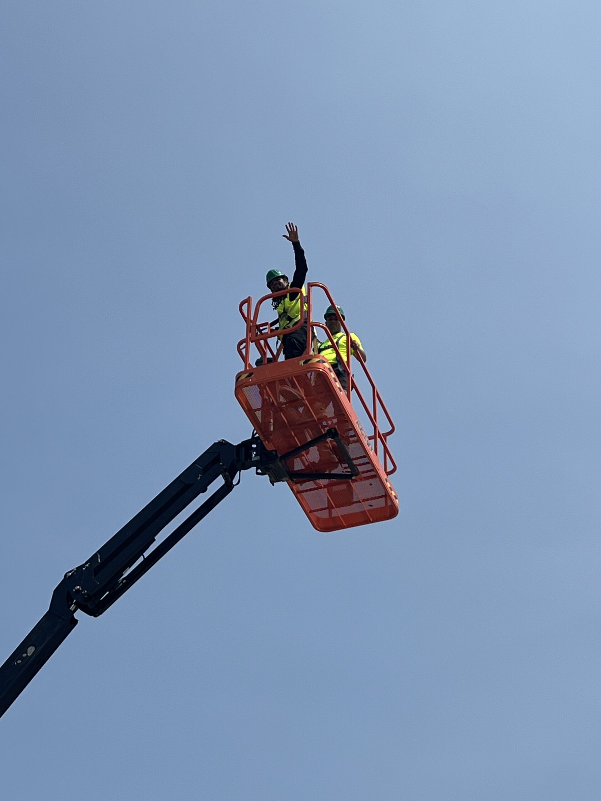 Construction Workers in Cherry Picker