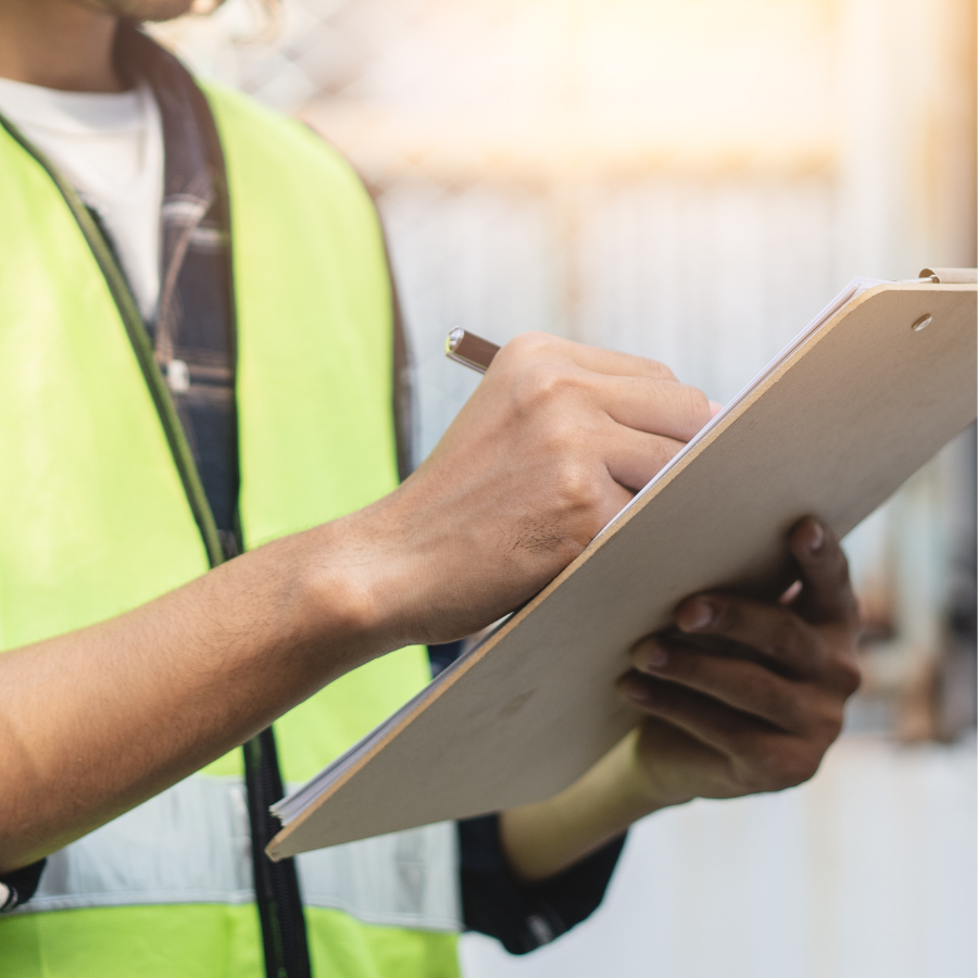 Worker writing on clipboard